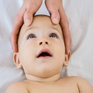hands-mother-touching-head-her-baby-boy (1)