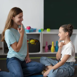 psychologist-helping-little-girl-speech-therapy (1)